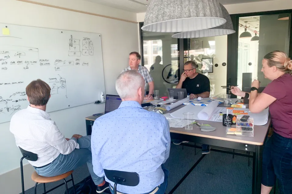Workshop session with the team around a table.